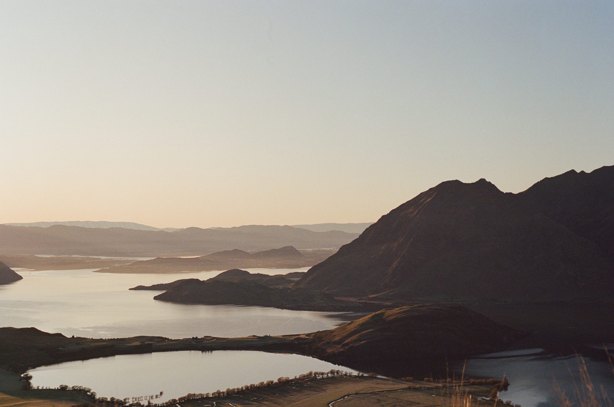 Landscape of Wānaka featuring mountains and lakes.