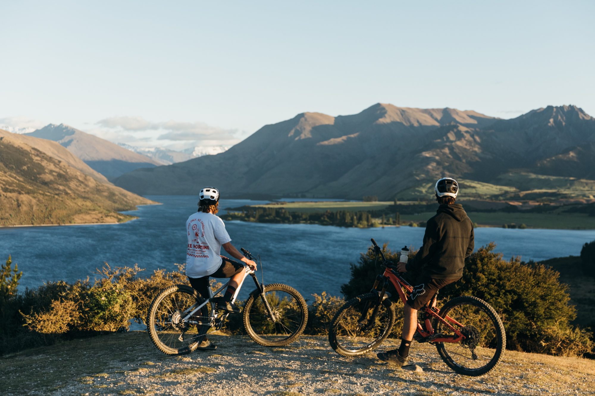 Two men on a bike overlooking Lake Wanaka.