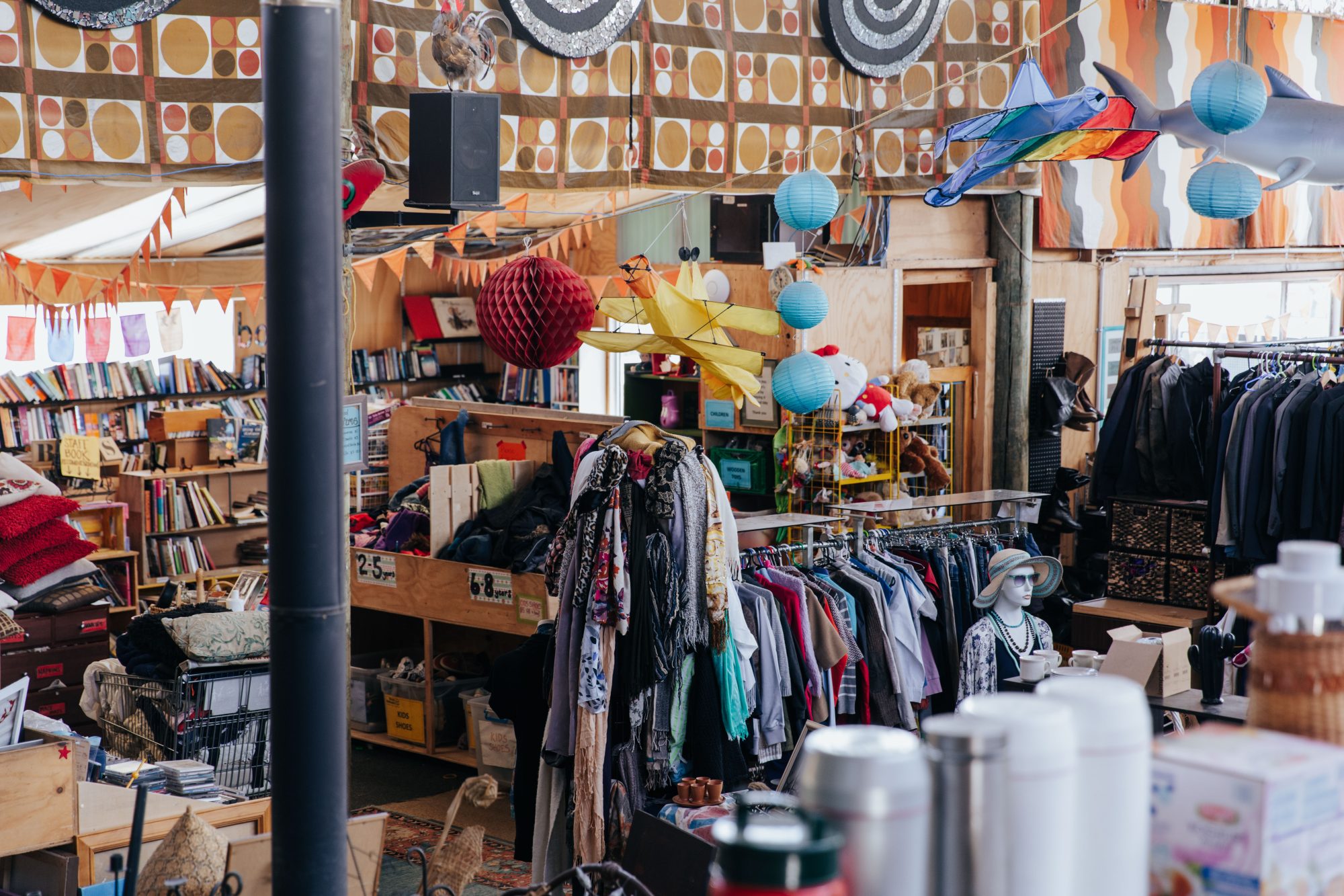 Inside of a recycled clothing and homewares shop.