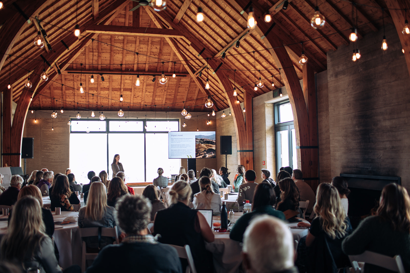 Woman public speaking at a community event.