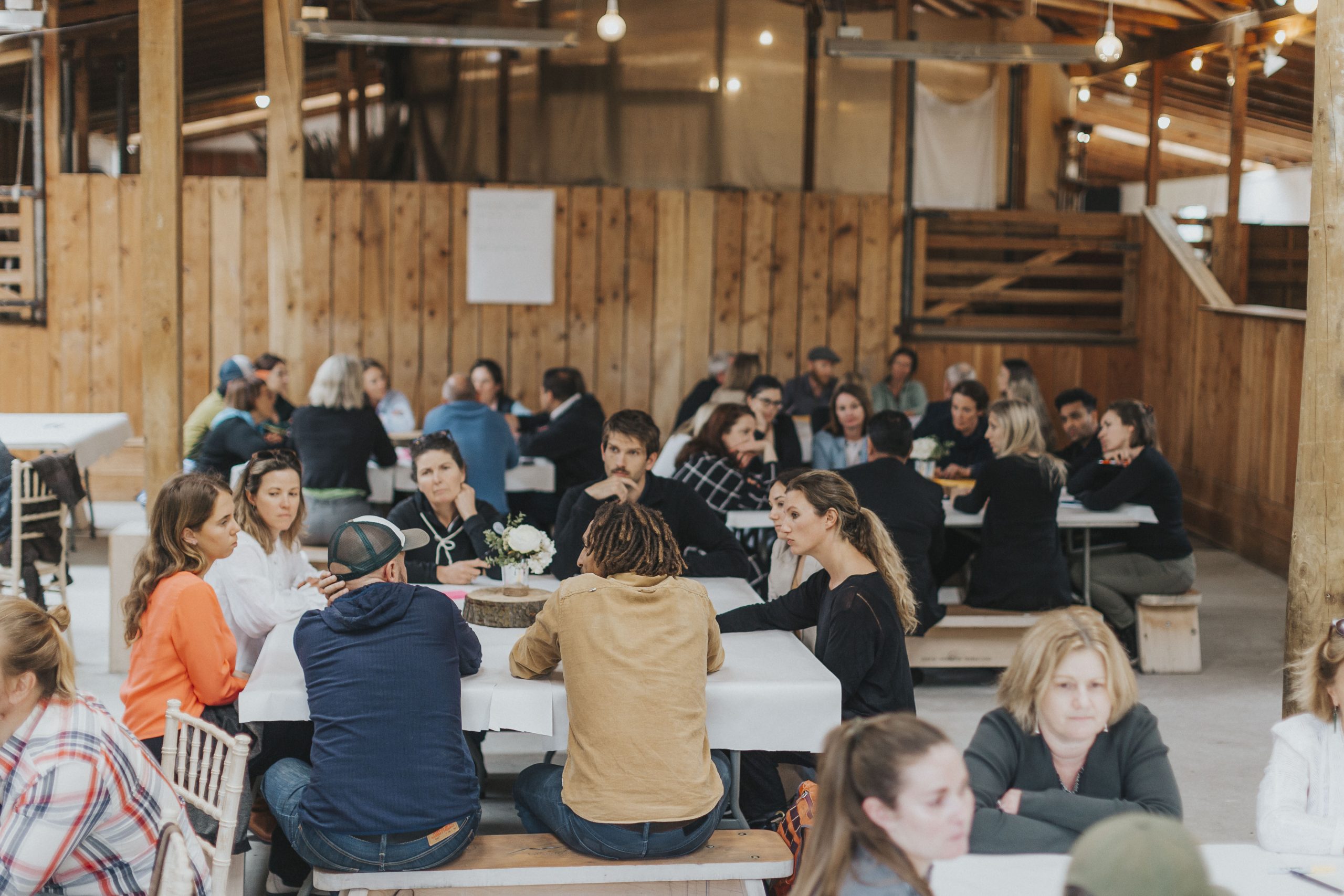 People sitting at a table having a conversation.