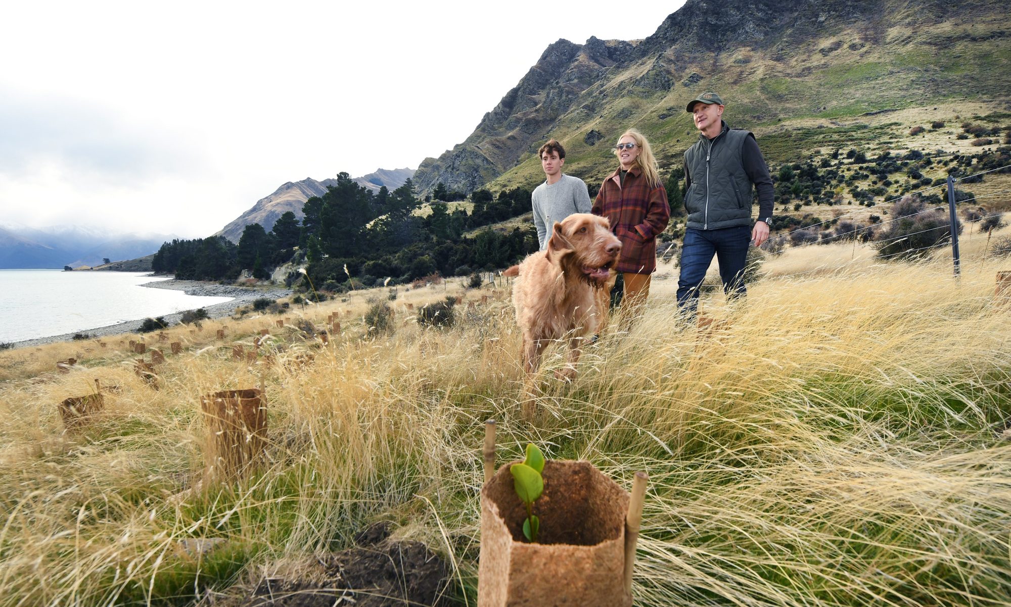 Family of farm owners with their dog