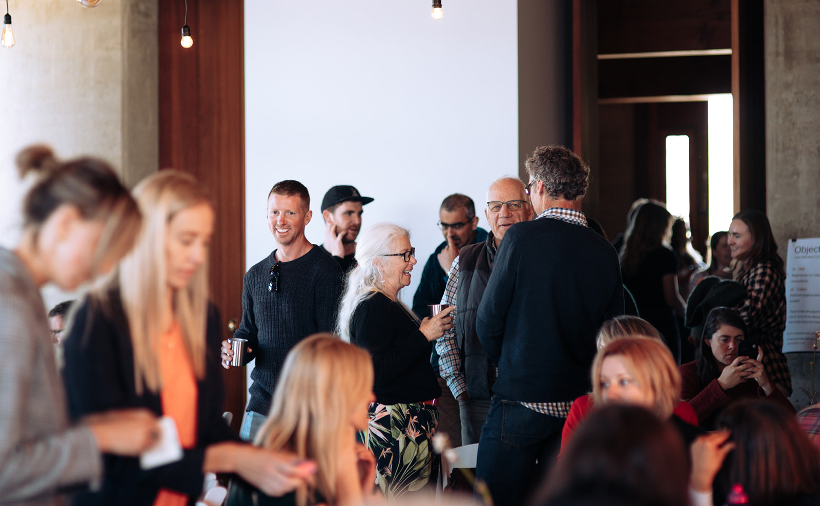 Individuals chatting and mingling at business conference