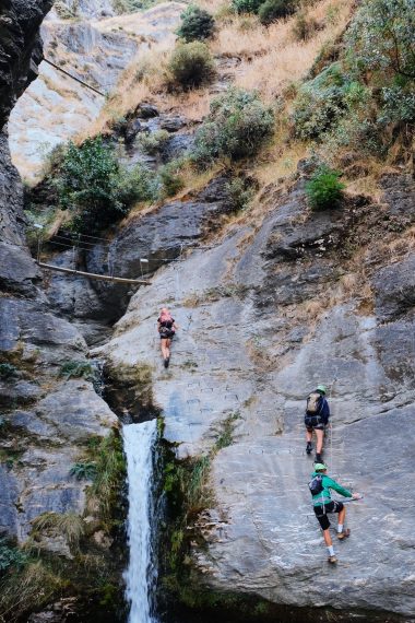 3 climbers climbing up a a rockface at Wildwire in Wānaka New Zealand
